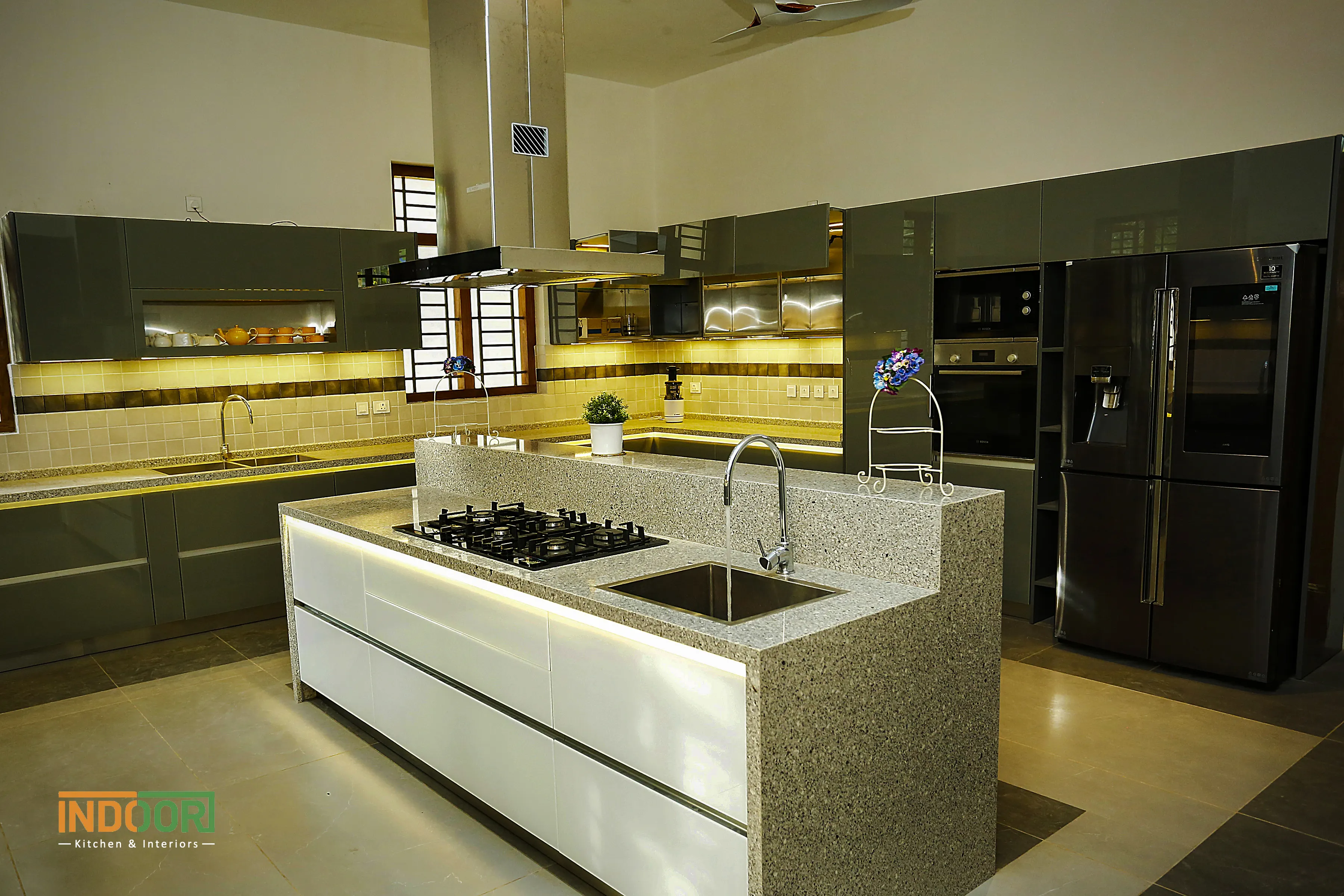 Custom stainless steel island kitchen design in Kozhikode